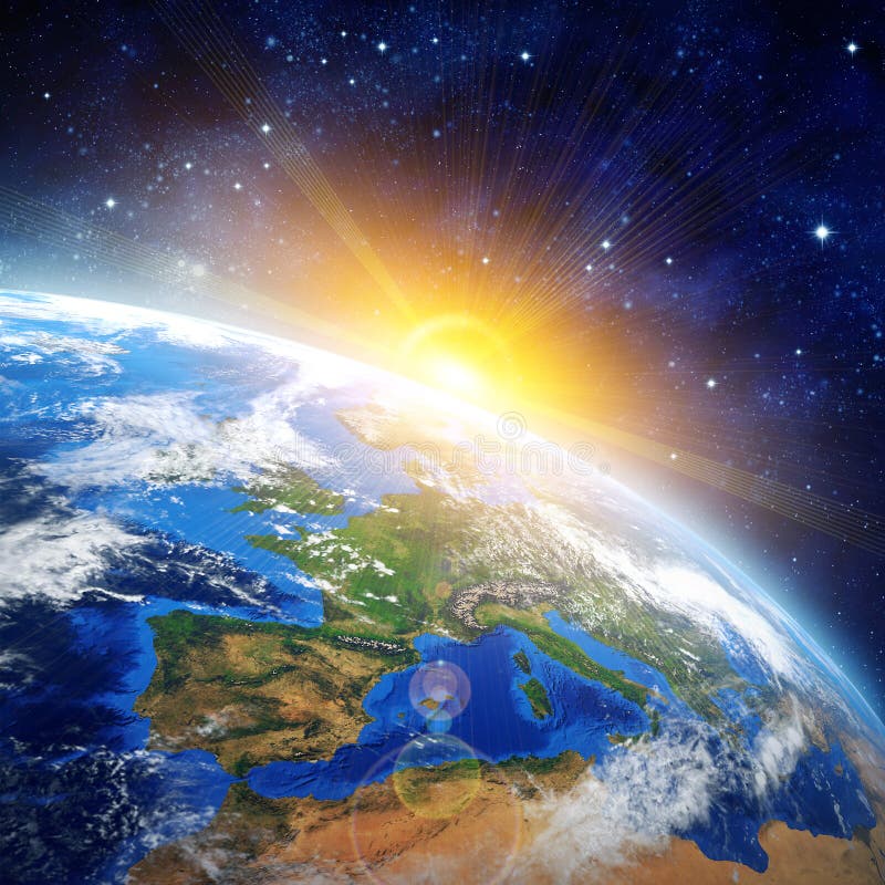 The earth glowing with sunrise light from space